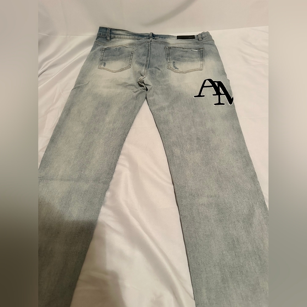 AMIRI Faded Blue Slim Jeans with Black Logo - Picture 2 of 4